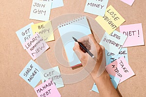 People write down an important note, using on the paper stickers post it