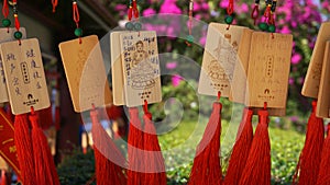 People write and hang Ema Wood tag or Wooden label for praying for good luck