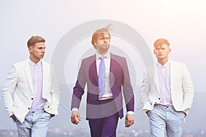 People of young man, businessman, guys walking on blue sky