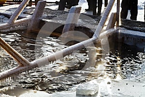 Peoples near ice-hole in frozen lake