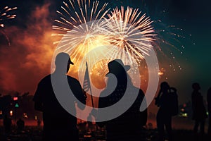 Peoples in silhouette enjoy watching amazing firework show in a festival or holiday