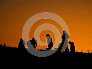 Peoples silhouette at sunset