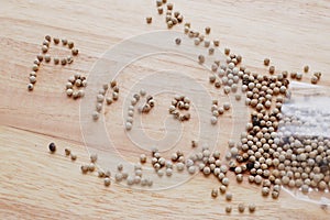 Pepper alphabet letters on table wood in order to describe what this spice is