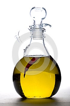 Pepper in cruet of olive oil.