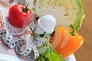 Pepper, egg, cabbage, tomato, salad and ruler on the table