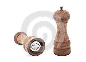 Pepper grinder isolated on white. Two old wooden pepper grinder isolated