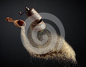 Pepper grinder and spoon with pepper ground