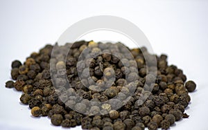 Pepper, heap of Black cubeb or Black Peppercorn Cubeb,Cubeb, medicinal plant and spice