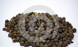 Pepper, heap of Black cubeb or Black Peppercorn Cubeb,Cubeb, medicinal plant and spice