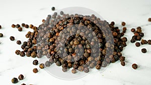 Pepper, heap of Black cubeb or Black Peppercorn Cubeb,Cubeb, medicinal plant and spice
