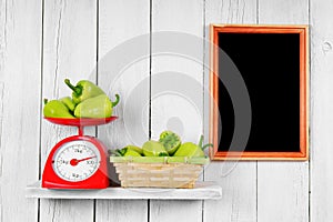 Pepper on scales in a basket