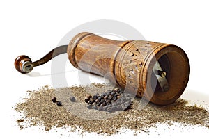 Peppercorn, grinder and grounded pepper isolated on white