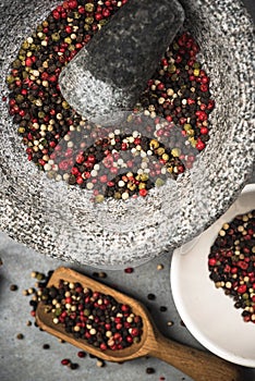 Peppercorn seed in granite mortar or pestle