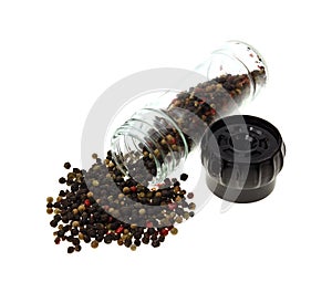 Peppercorns Spilling from Jar