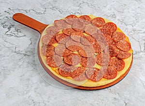 pepperoni cheese pizza with tomatoes, cheese fast food ready to eat on marble background top view