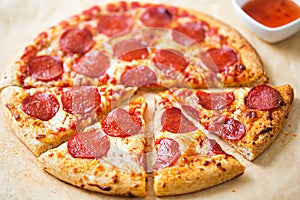 Pepperoni pizza with chilli dip