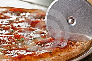 Pepperoni pizza cutter photo