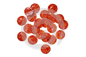 Pepperoni Slices on white. Ingredients for meat pizza. photo
