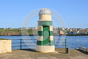 Pepperpot lighthouse at end of breakwater