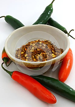 Peppers, fresh and dried flake in bowl