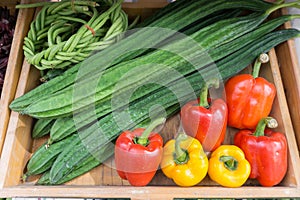Peppers, Luffa acutangula and long beans at market