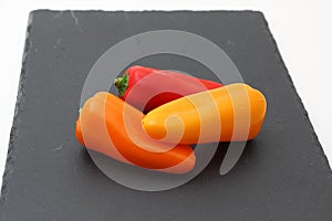 Peppers on slate photo