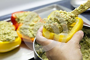 Peppers stuffed with quinoa and avocado pesto