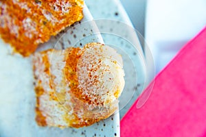 Peppery crackers on a plate with cream soup