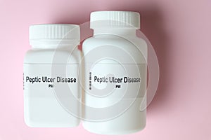 Peptic Ulcer Disease pill in white bottle, pill stock