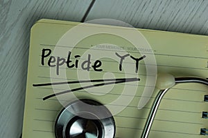 Peptide YY write on a book isolated on office desk