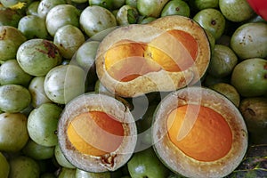 Pequi fruit in street market stall photo