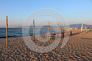 Peraia beach, suburb of Thessaloniki, Greece. View of a restaurant, tables and chairs, sunset time.