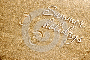 The percent sign is drawn in the sand. Beach background. Top view. The concept of summer, summer kanikkuly, vacation, holydays photo