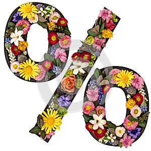 Percent sign made of real natural flowers and leaves on white background.