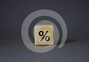 Percentage sign symbol. Percentage sign on wooden cubes. Beautiful grey background. Business and Percentage sign concept. Copy