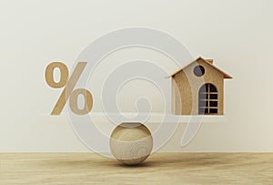 Percentage symbol icon and house scale in equal position. financial management concept : depicts short term borrowing for a