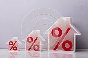 Percentage Symbols Inside Increasing House Models