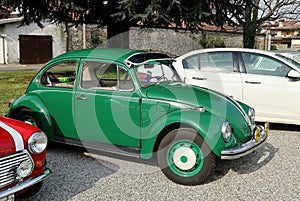 Vintage green Beetle, or Type 1, parked at the road side