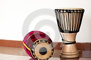 The percussion instruments mridangam and djembe