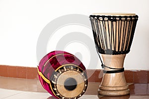 The percussion instruments mridangam and djembe photo