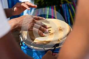 Percussionist hands playing atabaque