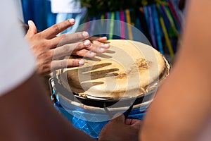 Percussionist hands playing atabaque