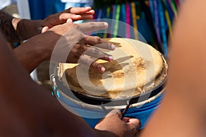 Percussionist hands playing atabaque