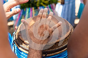 Percussionist hands playing atabaque