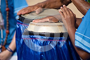 Percussionist hands playing atabaque. musical rhythm. African music