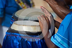 Percussionist hands playing atabaque. musical rhythm. African music