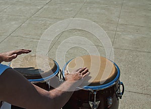 The Percussionist fast hands playing the congas