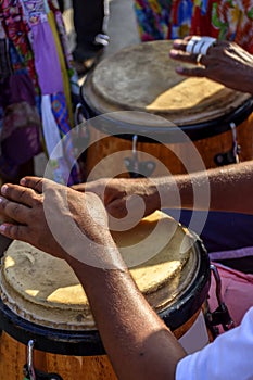 Percussionist playing atabaque during samba performance
