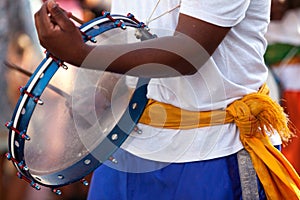 Percussionist playing with a frame drum
