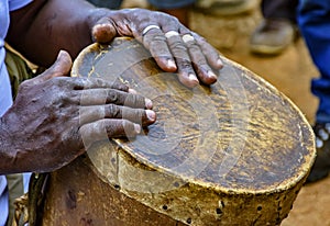 Percussionist playing a rudimentary atabaque photo